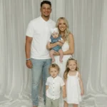 Patrick and Brittany Mahomes pictured with their three children at a public event