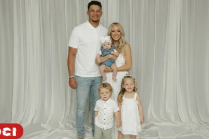 Patrick and Brittany Mahomes pictured with their three children at a public event